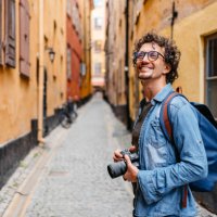 young tourist walking through the alley - travel stock pictures, royalty-free photos & images