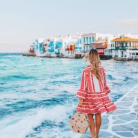 young tourist woman walks through the streets of mykonos island, cyclades, greece - fashion stock pictures, royalty-free photos & images