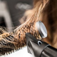 young woman at a hair salon ,hairdresser using hairdryer - hairstyle stock pictures, royalty-free photos & images