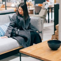 young woman at furniture store choosing sofa - home decoration stock pictures, royalty-free photos & images