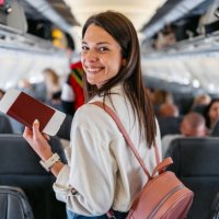 young woman boarding an airplane - travel stock pictures, royalty-free photos & images