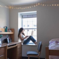 young woman college student in her dorm room with laptop - home decoration stock pictures, royalty-free photos & images