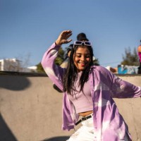 young woman dancing and having fun during street party - fashion stock pictures, royalty-free photos & images