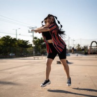 young woman dancing reggaeton at skateboard park - fashion stock pictures, royalty-free photos & images