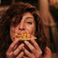 young woman eating food at bar - food stock pictures, royalty-free photos & images