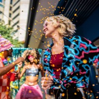 young woman enjoying carnival with friends at home - garden decoration stock pictures, royalty-free photos & images