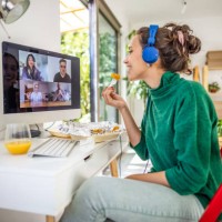 young woman having a video call with her friends - junk food stock pictures, royalty-free photos & images