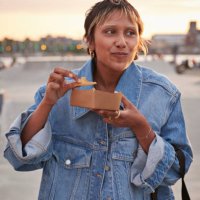 young woman having food on weekend - junk food stock pictures, royalty-free photos & images