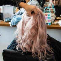 young woman having her hair done - hairstyle stock pictures, royalty-free photos & images