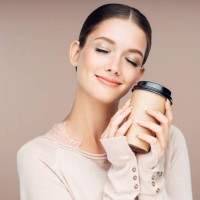 young woman holding hot coffee - junk food stock pictures, royalty-free photos & images