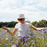 young woman in a sea of blue cornflowers - fashion stock pictures, royalty-free photos & images