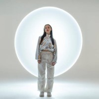 young woman in front of a circular light shape - fashion stock pictures, royalty-free photos & images