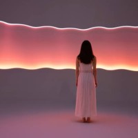 young woman in front of orange light trails - fashion stock pictures, royalty-free photos & images