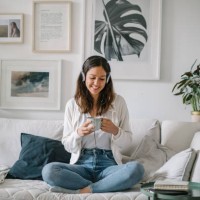 young woman listens to musics through headphones - home decoration stock pictures, royalty-free photos & images