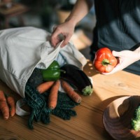 young woman organising groceries after shopping - food stock pictures, royalty-free photos & images