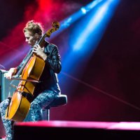 young woman playing cello on the concert - concert stock pictures, royalty-free photos & images