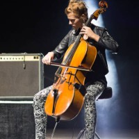 young woman playing cello on the stage - concert stock pictures, royalty-free photos & images