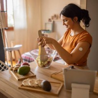 young woman preparing a healthy salad - food stock pictures, royalty-free photos & images