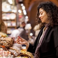 young woman shopping in turkish delight shop in grand bazaar, istanbul, turkey - food stock pictures, royalty-free photos & images