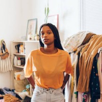 young woman standing in room - fashion stock pictures, royalty-free photos & images