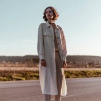 young woman standing on road at sunrise - fashion stock pictures, royalty-free photos & images