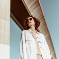young woman standing under bridge at sunrise - fashion stock pictures, royalty-free photos & images