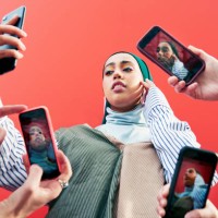 young woman surrounded by smartphones. - fashion stock pictures, royalty-free photos & images