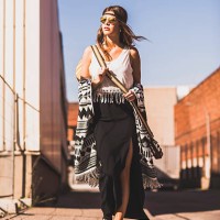 young woman wearing boho style walking on street - fashion stock pictures, royalty-free photos & images