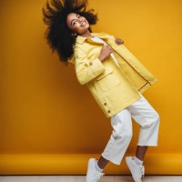 young woman wearing raincoat - fashion stock pictures, royalty-free photos & images