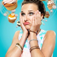 young woman with flying cupcakes around her head, composite - food stock pictures, royalty-free photos & images