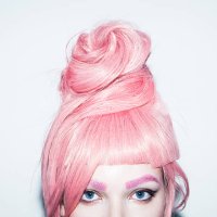 young woman with pink hair wig in an updo, crop. - hairstyle stock-fotos und bilder