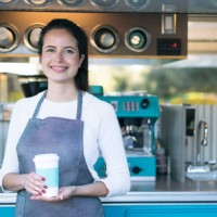 young woman working at a food truck - junk food stock pictures, royalty-free photos & images