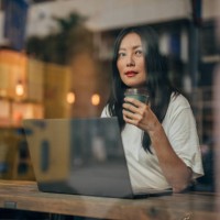 young woman working on laptop in cafe - fashion stock pictures, royalty-free photos & images