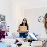 young women bringing pizza for friends studying at home - junk food stock pictures, royalty-free photos & images