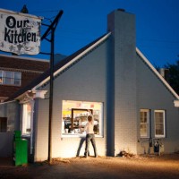 young women holding a picture frame at a diner. - home decoration stock pictures, royalty-free photos & images