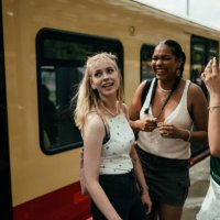 young women on a railway platform - travel stock pictures, royalty-free photos & images
