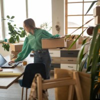 young working hard to satisfy all her online fashion shop customers - fashion stock pictures, royalty-free photos & images