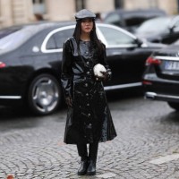 Yoyo Cao is seen outside Chanel show wearing black leather barrett, black patent Chanel coat, black leather high knee boots, white camellia Chanel...
