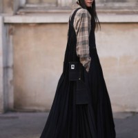 Yoyo Cao seen wearing a Sacai X Carhartt denim long jumpsuit dress, grey hat, Celine black sunglasses and a brown checkered blouse outside Sacai show...