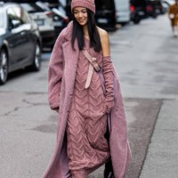 Yoyo Cao wears lavender knit dress, teddy coat, beanie outside Max Mara during the Milan Fashion Week - Womenswear Spring/Summer 2024 on September...