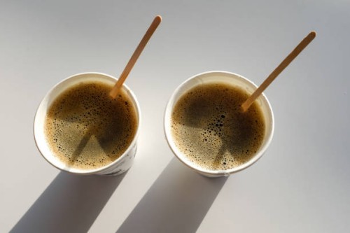 2 paper cup boxes are on the table in the cafe. coffee to go. morning. - junk food stock pictures, royalty-free photos & images