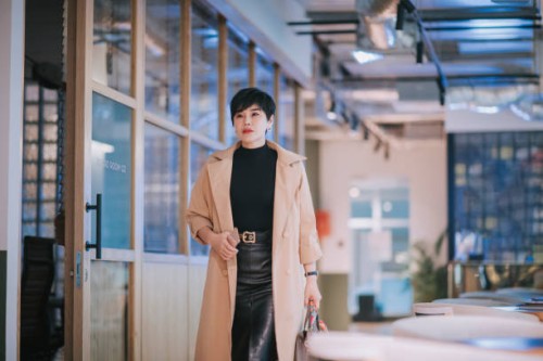 2 successful asian chinese businesswomen walking in office happily - fashion stock pictures, royalty-free photos & images
