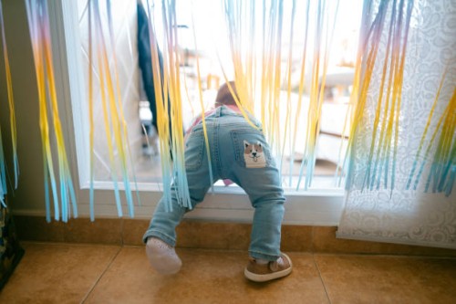 a baby trying to get out on the terrace - home decoration stock pictures, royalty-free photos & images