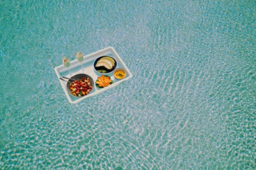 a breakfast tray floats across a pool (wide) - food stock pictures, royalty-free photos & images