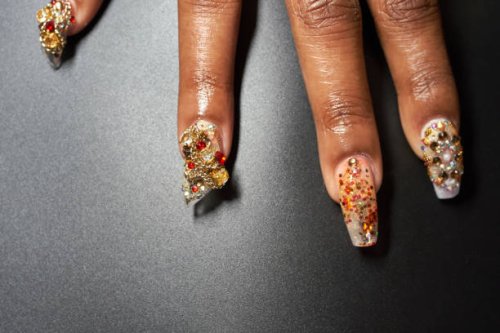a close-up of a manicured hand and chandelier nails - nails art stock pictures, royalty-free photos & images
