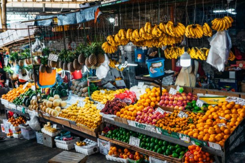 a colorful display of fresh fruits in a market stall in baguio, philippines, featuring various types of tropical produce. - food stock pictures, royalty-free photos & images