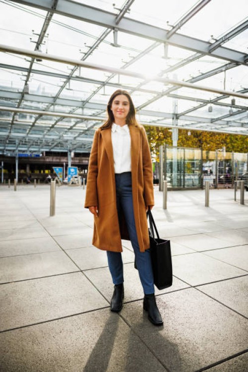 a confident and well dressed woman at the aiport - fashion stock pictures, royalty-free photos & images