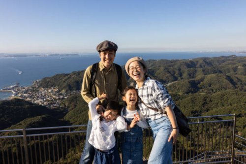 a family climbing a mountain in a travel destination. - travel stock pictures, royalty-free photos & images