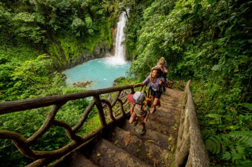 a family hiking at rio celeste waterfall in costa rica. - travel stock pictures, royalty-free photos & images