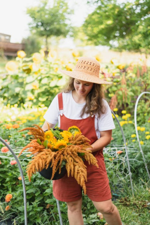 a flower farmer carrying a fall flower bouquet from her cut flow - garden decoration stock pictures, royalty-free photos & images